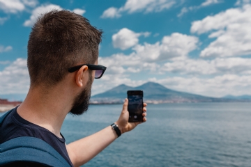 方案配图 kaboompics_A man taking a picture of the volcano Vesuvius with his mobile phone, Naples, Italy.jpg